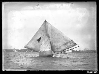 Skiff under full sail on Sydney Harbour