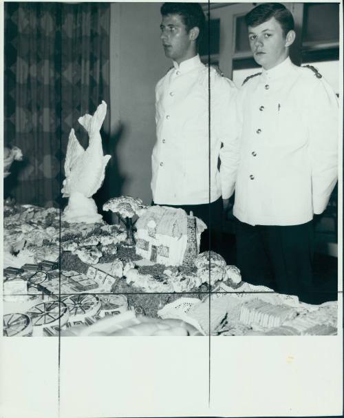 PUBLIC RELATIONS 54. Two ship's stewards standing at a smorgasbord