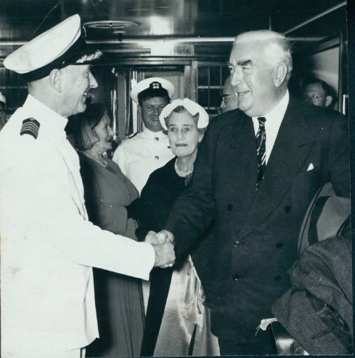 Captain J.D. Birch of the ORDCADES shaking hands with Sir Robert Menzies