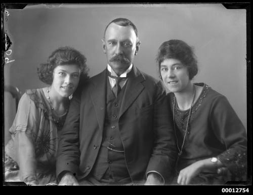 Group portrait of one man and two women, inscribed 309