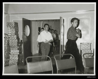 Group of young men entering a room