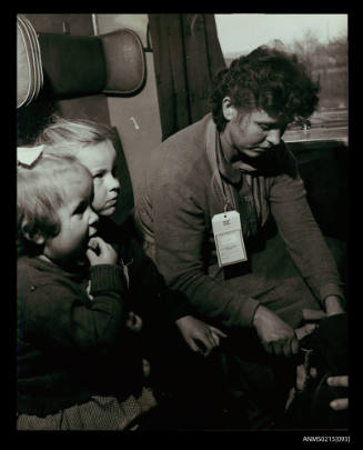 Refugee mother with two young children in train from Yugoslavia en route to Australia