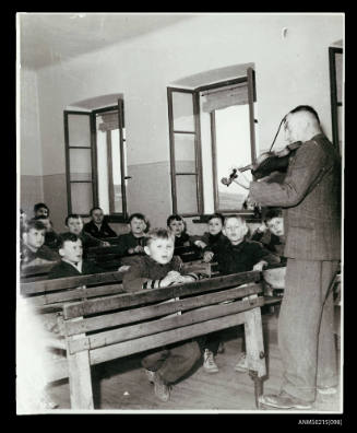 Children at music class at displaced persons camp, Europe