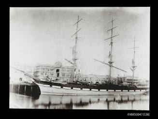 Full-rigged ship LAKE SUPERIOR docked at a wharf