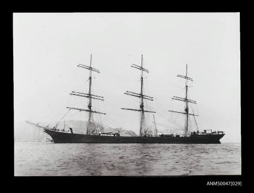 Full-rigged ship KING DAVID at anchor in a harbour