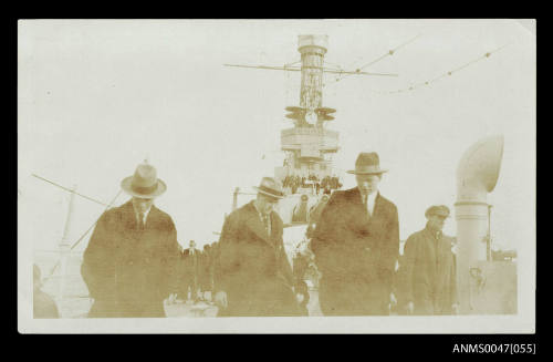 United States naval visit - men in civilian clothes on the deck of a warship