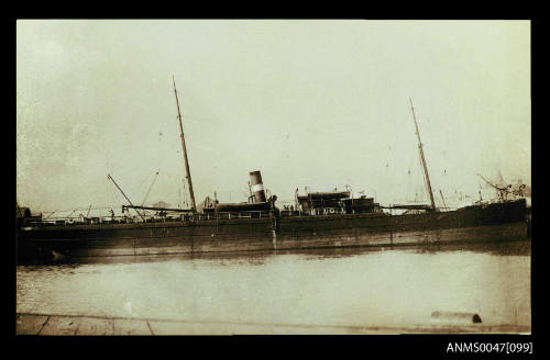 Steamship docked at a wharf