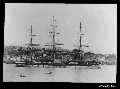 Full-rigged ship VOLGA anchored to a buoy in a river port