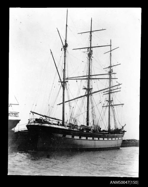 Full-rigged ship LOCH LAMOND, docked at a wharf