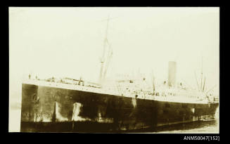 SS THEMISTOCLES being towed in a harbour