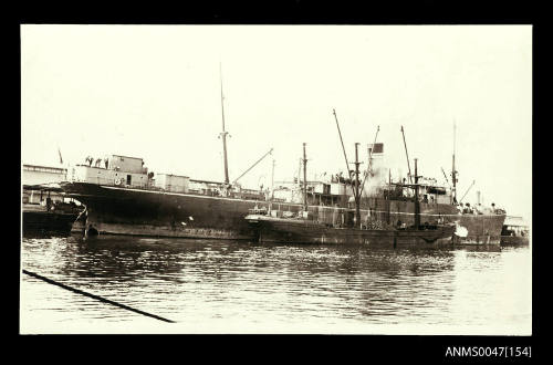 SS CARPENTARIA with a coal barge alongside