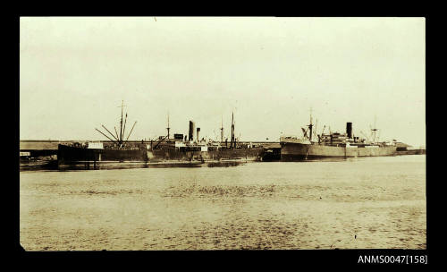 SS PORT BRISBANE and another steamship docked at a wharf