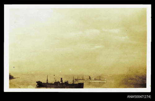 SS BARUNGA and other steamships viewed from a headland