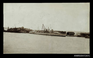 HMAS CANBERRA docked at a wharf