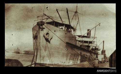 Cargo steamship docked at a wharf