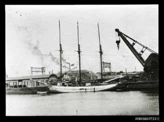Schooner ROOGAUAH docked at Princes Wharf, steam crane in foreground