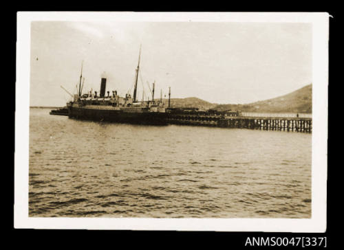 Jetty with a steamship docked at end of it