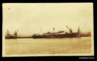 View from across a harbour of SS DOM PEDRO I docked at wharf