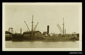 SS JOAN CRAIG docked at a wharf with Buchanan & Brock Engineers and Boiler Makers factory in background