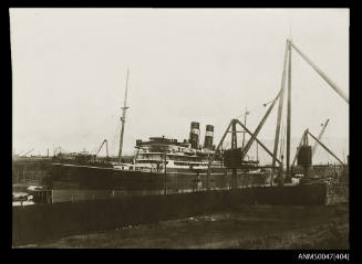 Portside SS INDARRA, 9735 tonnes, undergoing a re-fit in a small harbour