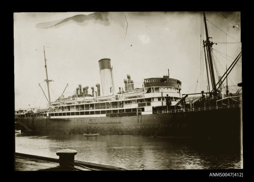 Passenger liner SS CANBERRA docked at a wharf