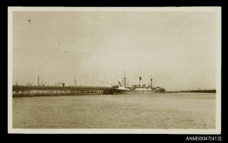 SS KNIGHT COMPANION docked at a long wharf