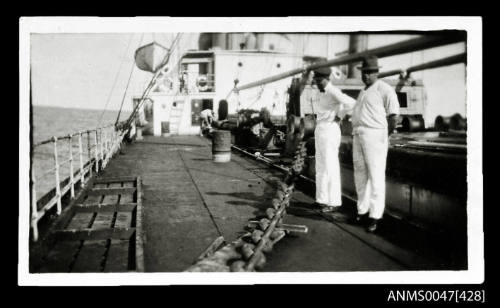 View of maindeck of towing vessel with anchor chain and tow rope