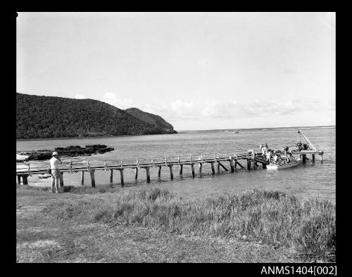 Vessel being loaded at a jetty at Lord Howe Island