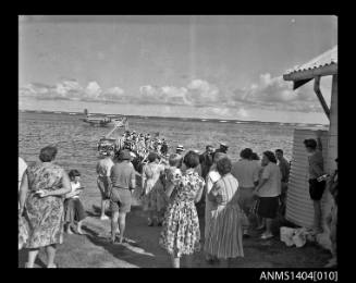 Crowd of people preparing to board an Ansett Airways flying boat on Lord Howe Island