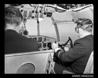 Pilots in the cockpit of an Ansett Airways flying boat