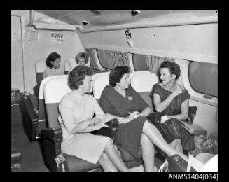 Female passengers inside the cabin of an Ansett Airways flying boat