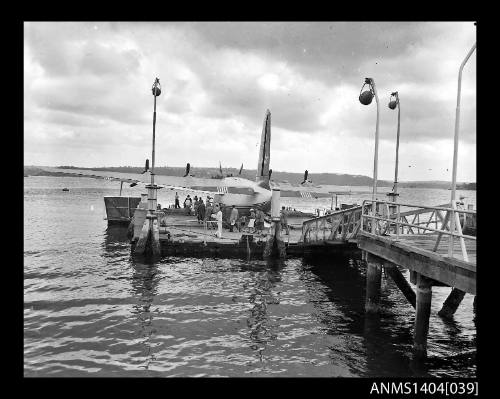 Passengers boarding an Ansett Airways flying boat at Rose Bay