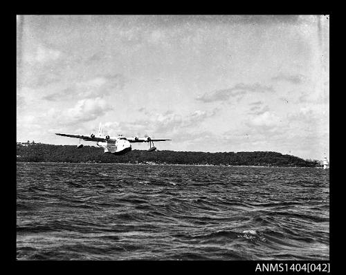 Ansett Airways flying boat PACIFIC CHIEFTAIN flying over Sydney Harbour