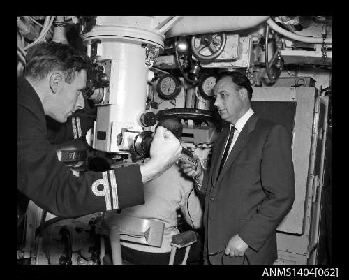 Navy officer operating the periscope on HMS ANCHORITE