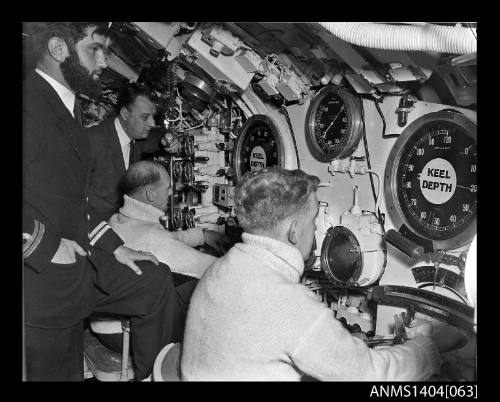 Crew at work in the control room of HMS ANCHORITE