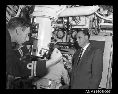 Navy officer operating the periscope on HMS ANCHORITE