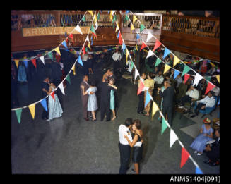 Photographic transparency showing passengers dancing aboard the ship FLAVIA