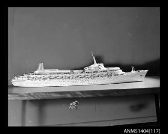 Photographic negative showing a scale model of the ship CANBERRA