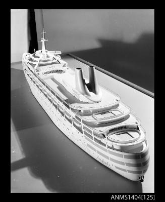 Photographic negative showing a scale model of the ship CANBERRA