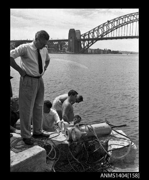 Photographic negative showing an AWA underwater television camera about to be tested in Sydney Harbour