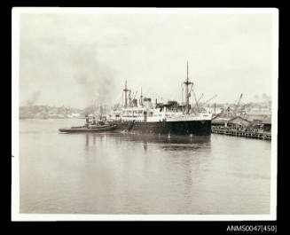 TSMV MANUNDA, 9155 tonnes, being berthed at a crowded wharf