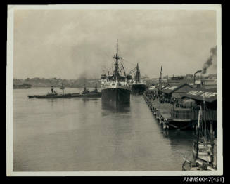 TSMV MANUNDA, 9155 tonnes, being berthed at a crowded wharf