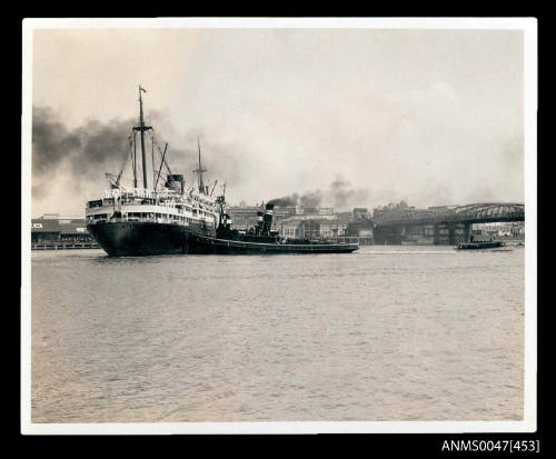 TSMV MANUNDA, 9155 tonnes, being berthed at a wharf