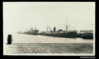 SS CLAN MACTAGGART, SS PORT NICHOLSON and other steamships docked at a wharf