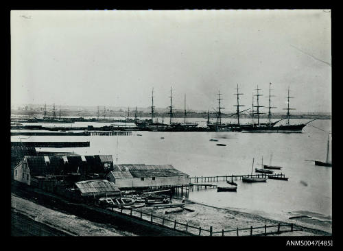 View of a river port with three sailing ships MEROPE, LOCH MAREE and SALAMIS I, moored at a jetty