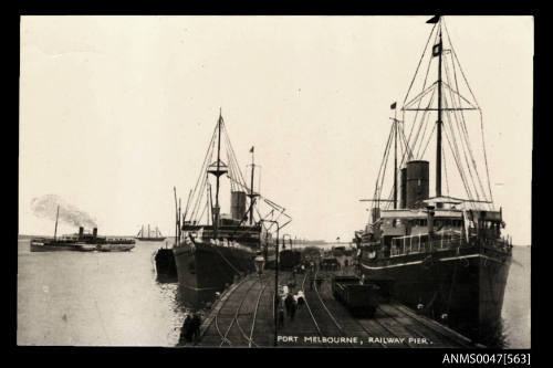 Two unidentified steam ships berthed at a wharf in Port Melbourne atrailway pier