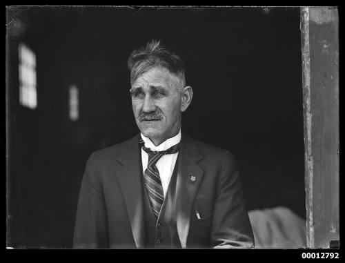 Portrait a man outside SCEGS boatshed, Berrys Bay