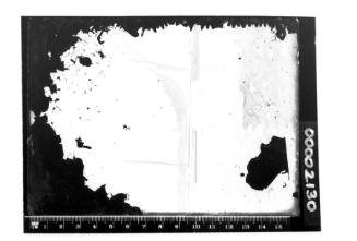 A badly damaged glass plate negative of a cutter and Sailing vessel on Sydney Harbour with four people visible on board