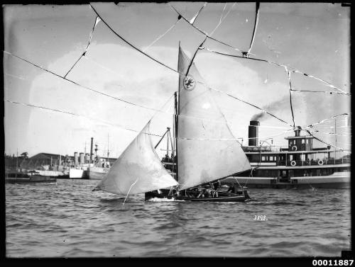 Sailing vessel passing a ferry on Sydney Harbour