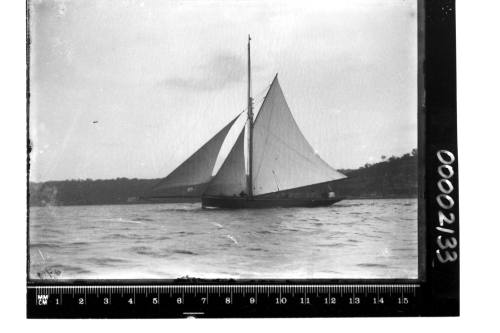 Portside view of a cutter on Sydney Harbour